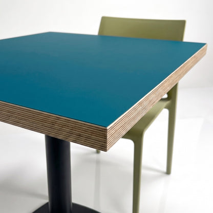 Dina 60x60cm Prussian blue & wood high table in a sleek style